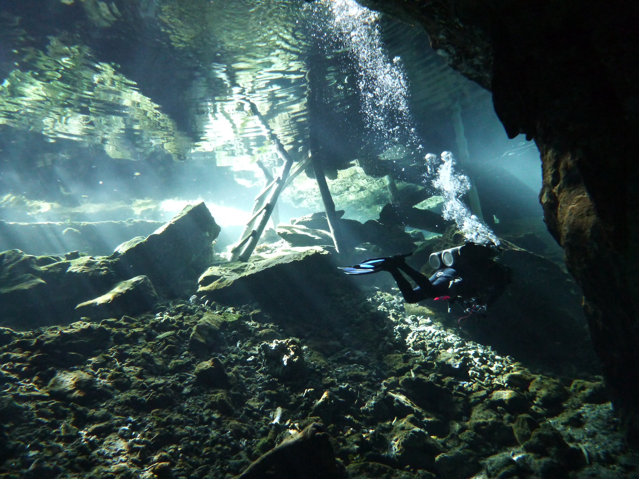 Scuba diver near the exit ladder, Gran Cenote